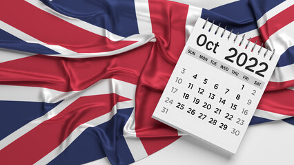 White-colored October calendar page and English flag. Horizontal composition with copy space. Isolated with clipping path.