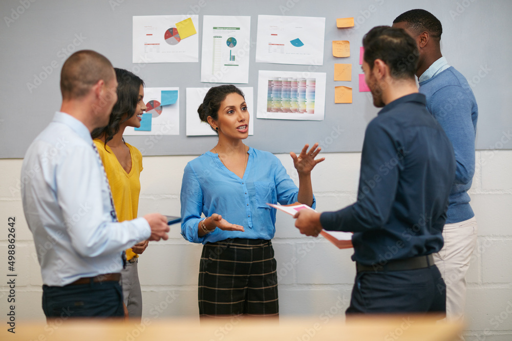 Poster theres always time to discuss an idea. cropped shot of a group of businesspeople talking in the offi
