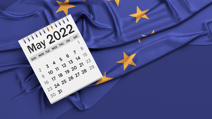 White-colored May calendar page and European Union flag. Horizontal composition with copy space. Isolated with clipping path.
