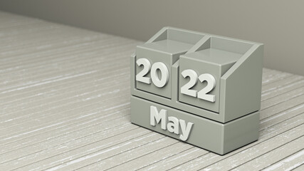 Evergreen fog-colored cubic May 2022 calendar. Horizontal composition with copy space. Focused image.