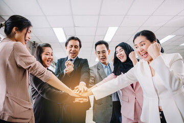 Selective focus on hands. Group business team showing unity and power with their hand's success together at the office.