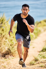 Fototapeta premium Id always choose good health over everything else. Shot of a young man out for a run.