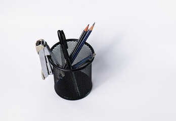 A small black basket made of round steel. Can be used to store office supplies, including pens,...