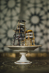 stack of Champagne cages on tiny pedestal dish