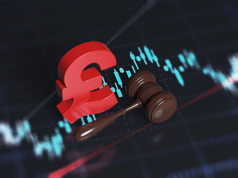 Red-colored Pound symbol and judgment gavel. On the black-colored finance chart screen. Horizontal composition with copy space. Focused image.