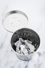 writer's block concept, garbage bin with scrunched paper inside of it