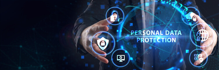 Cyber security data protection business technology privacy concept. Young businessman  select the icon Personal data protection on the virtual display.