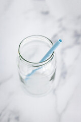 upcycled glass jar with silicon straws instead of plastic container and straws, zero waste and environmentally conscious choices