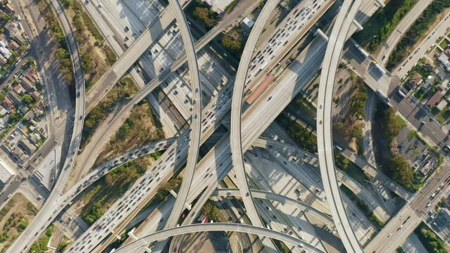 Spectacular aerial view turning overhead shot of busy traffic on highway
