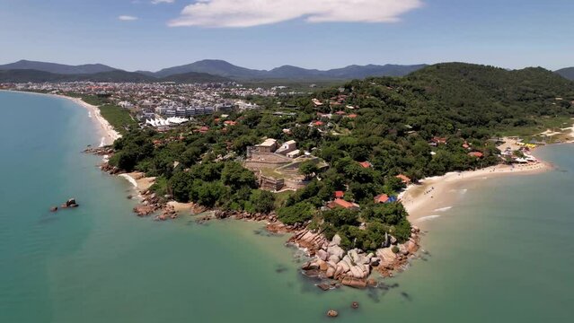 Partial Aerial Side Orbit Around Historic Sao Jose da Ponta Grossa Fortress and Jurere Internacional Tropical Peninsula Florianopolis Brazil Santa Catarina Drone 4k