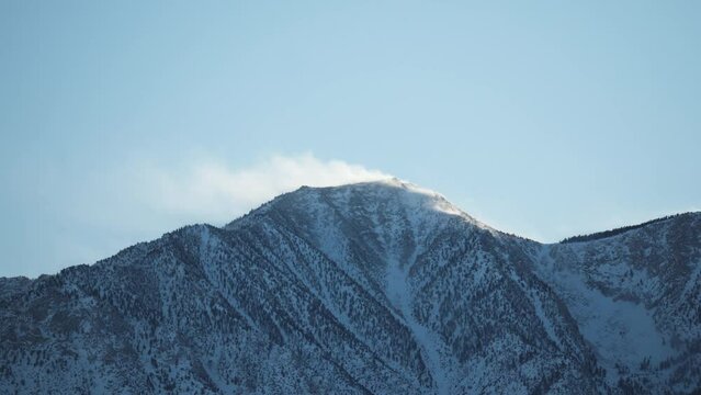Wind blowing snow on mountain peak, East side of sierra Nevada, California