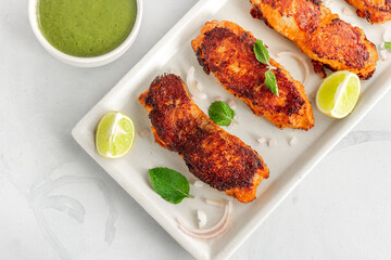 Tandoori Fish, Fish Tikka with Green Chutney, Lemon and Fresh Mint, Top Down Indian Food Close UpPhoto
