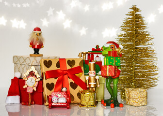 Frog in Santa costume amongst Christmas presents