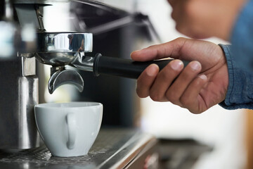 The heart of good coffee lies in its preperation. Cropped shot of a barista making a cup of coffee.