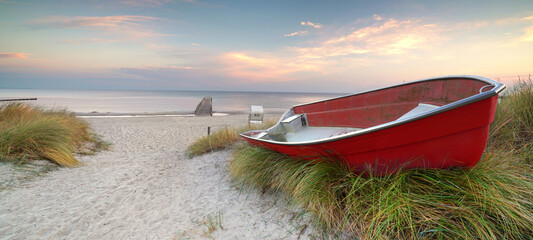 red boat at the beach