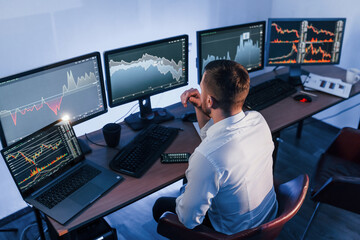 Business strategy. Stock trader working in the office with exchange technology
