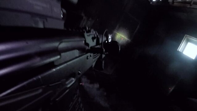 Riot police training indoors. Two policemen in full uniform with a shield and weapons. Elimination of a conditional terrorist.