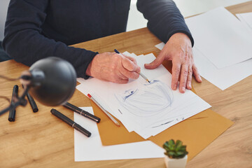 Top view of painter that working on the sketch of a man