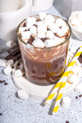 Refreshing Iced Hot Chocolate cocktail, milk sweet chocolate cold drink with marshmallow, white background copy space