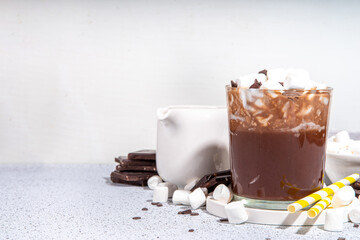 Refreshing Iced Hot Chocolate cocktail, milk sweet chocolate cold drink with marshmallow, white background copy space