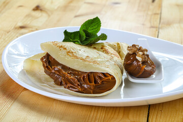 Delicous pancake with fruit jam