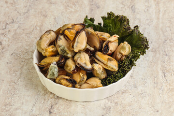 Tasty marinated mussels in the bowl