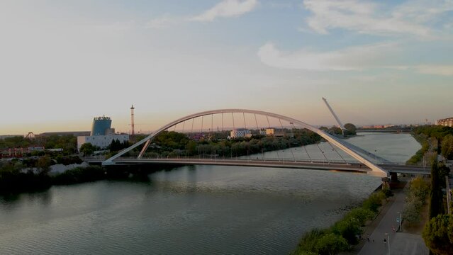 Reveal Shot of Guadalquivir River in Seville with Barqueta and Alamillo Bridges