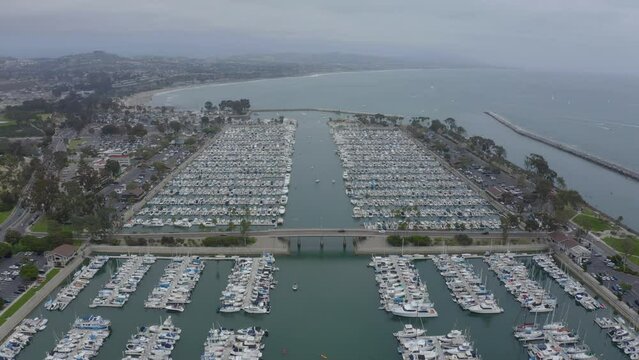A beautiful aerial drone shot, flying over Dana Point Harbor towards Doheny State Beach, Dana Point - Orange County - California
