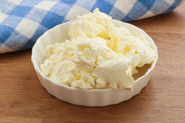 Italian soft mascarpone cheese in the bowl