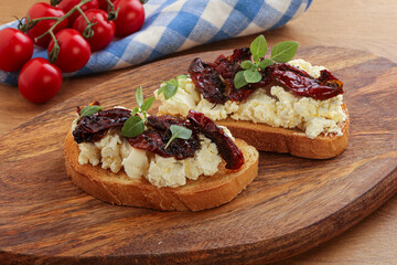 Bruschetta with soft cheese and tomato
