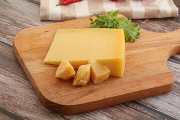 Parmesan hard cheese with small pieces