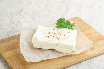 Fototapeta na wymiar Greek Feta cheese over board