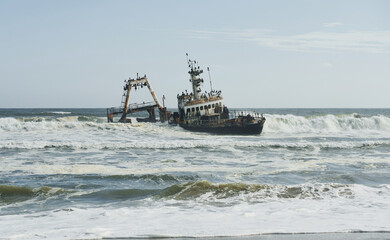 View of abandoned old drowned ship in the sea of Africa