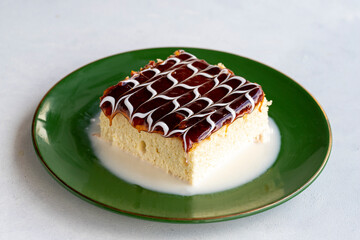 Caramel trilece cake. Trilece cake on a white background. . Bakery products. Close-up. local name trileçe pasta