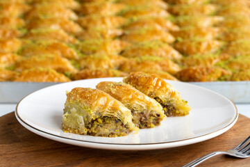 Pistachio sobiyet baklava. Pistachio baklava in plate. Traditional middle eastern cuisine flavors. Close-up.