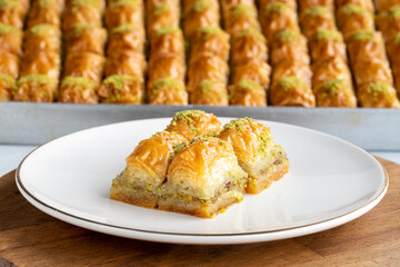 Pistachio baklava. Pistachio baklava in plate. Traditional middle eastern cuisine flavors. Close-up.