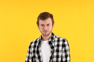 Concept of people with young man on yellow background