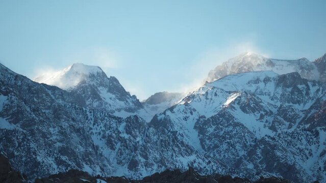 Wind blowing snow on mountain peaks, Sierra Nevada, California