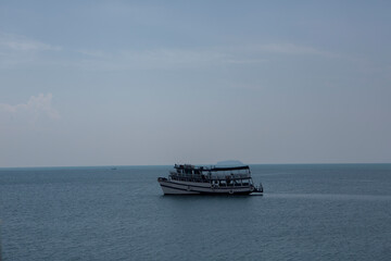 medium shot big boats on she sea sky  going to some where