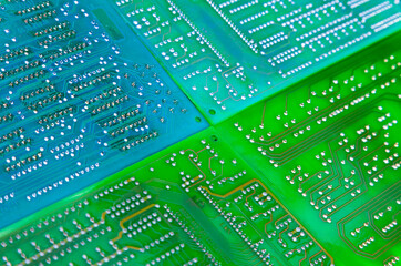 Computer circuit boards in green and blue colors, close-up.