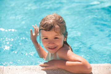 Fototapeta na wymiar Child boy swim in swimming pool. Happy little kid boy playing with in outdoor swimming pool on hot summer day. Kids learn to swim. Family beach vacation.