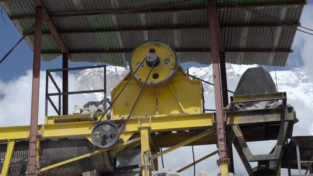 Rudraprayag, Uttarakhand India, January 24 2020. People using JCB to Remove the Thick layer of Snow from the route of Kedarnath Dham. Kedarnath Construction Work Disrupted by Heavy Snowfall.