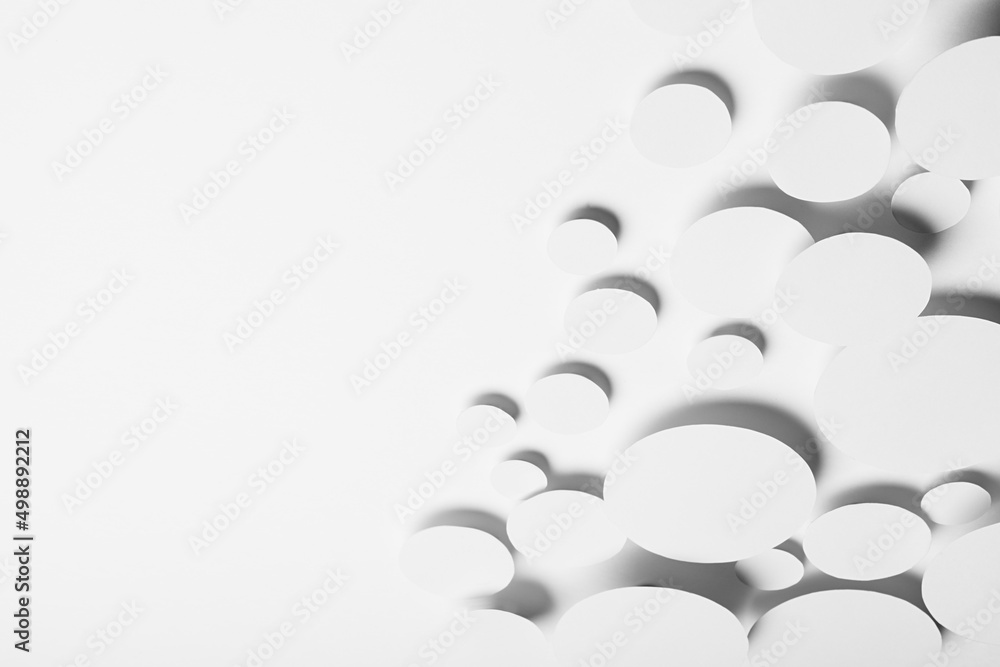 Poster geometric pattern of white ovals in shine light with soft grey shadows in random,, border, copy spac