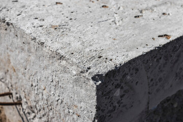 Concrete block close up. Reinforced concrete block corner. Texture of concrete.
