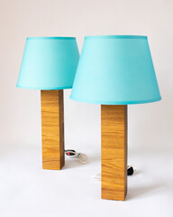 two turquoise floor lamps, a floor lamp on a neutral background, handmade isolated on a white...