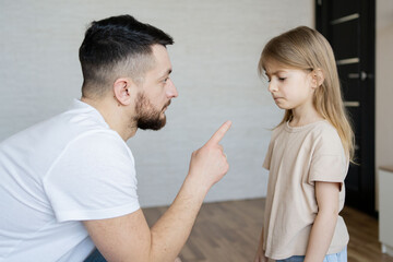 Domestic violence concept. father explains how to behave to the child. Focus on men.