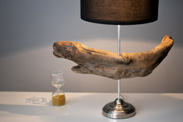 Unique handmade table lamp made of driftwood in the interior