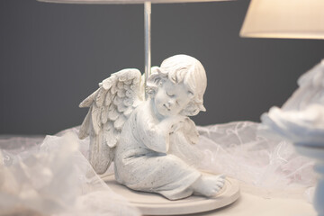 handmade floor lamp with an angel