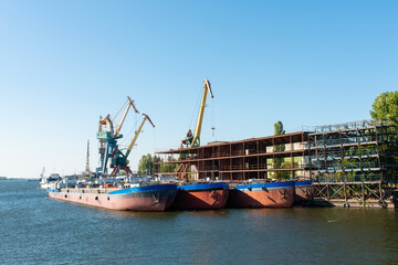 dry cargo ships moored for repair at a shipyard