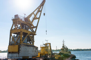 moored floating crane at the river shipyard